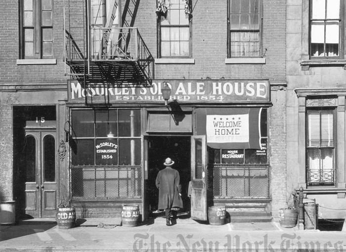 circa 1945:  A front exterior view of McSorley's Old Ale House, located on East Seventh Street, Manhattan, New York City. A man stands in the entrance. The tavern was founded by a woman, but served men only until a lawsuit was filed in 1970. A banner in the window reads 'Welcome Home- McSorley Boys'.  (Photo by Hulton Archive/Getty Images)