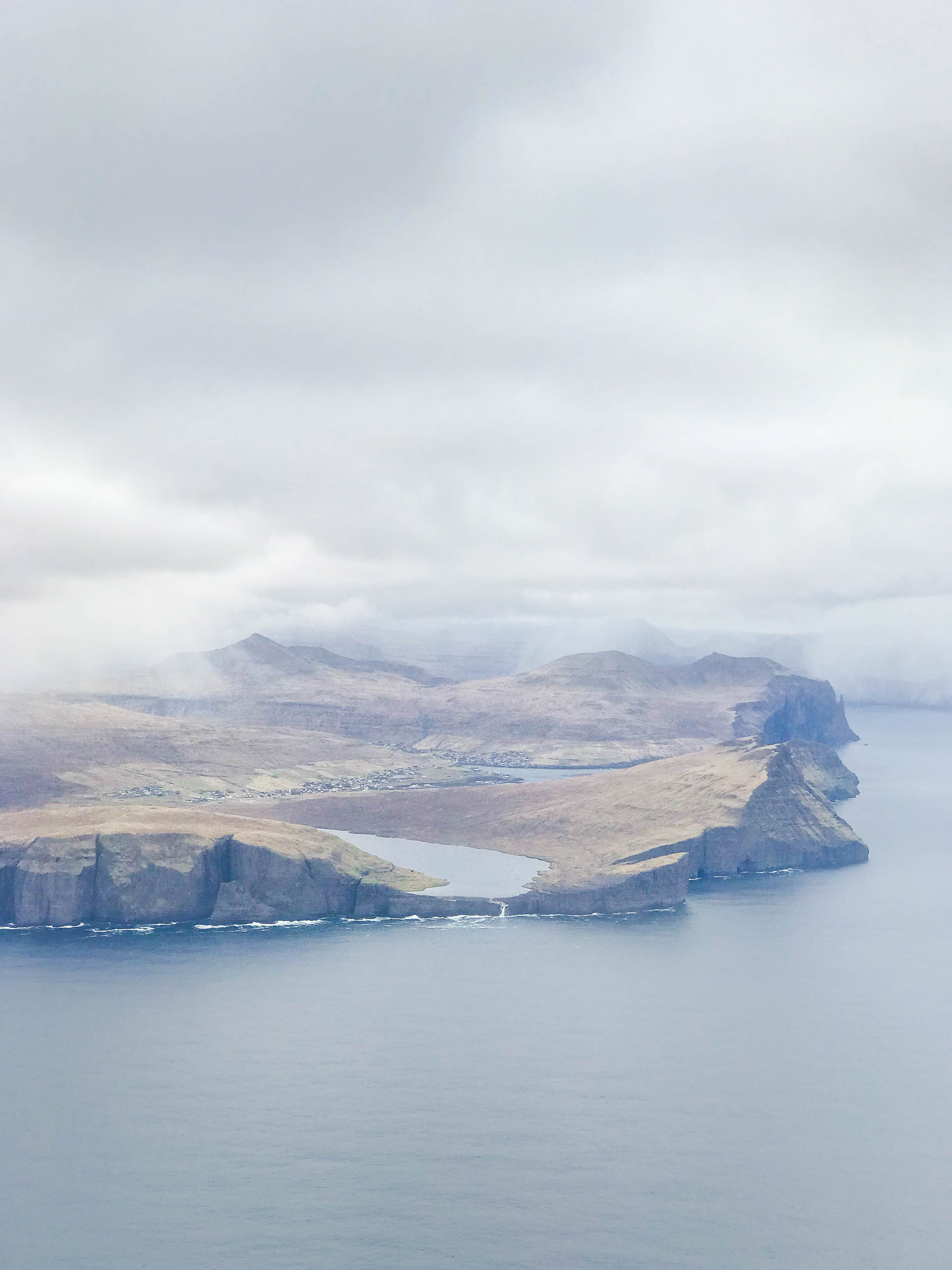 The Lake Sørvágsvatn hike out to Trælanípa cliffs and Bøsdalafossur waterfall | Faroe Islands | CompassAndTwine.com