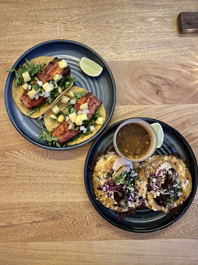 THIRD COURSE | korean pork belly tacos: gochujang, chrysanthemum, pineapple relish AND mushroom birria tacos: confit maitake, queso chihuahua, shiitake crema, vegetable consommé